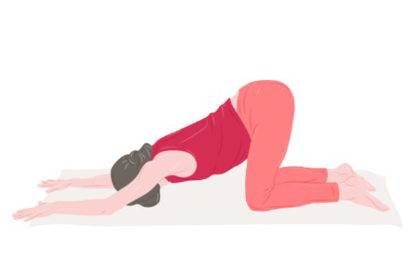 Woman in the yoga exercise Extended puppy pose.