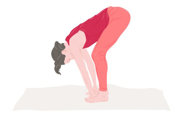 Woman standing in the hand to foot pose. Woman standing in the hand to foot pose.