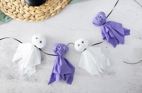 Making homemade Halloween ghosts: a finished Halloween themed garland.