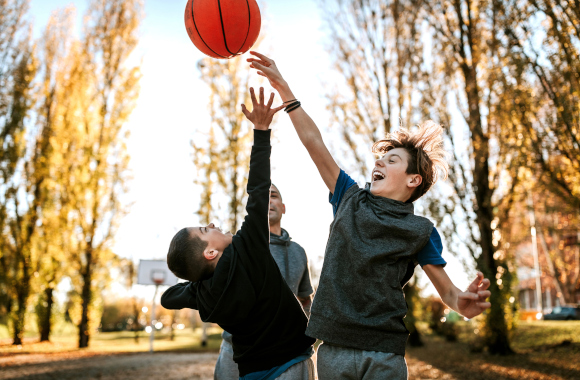 Gift for 10-year-old boy: boys playing basketball together.