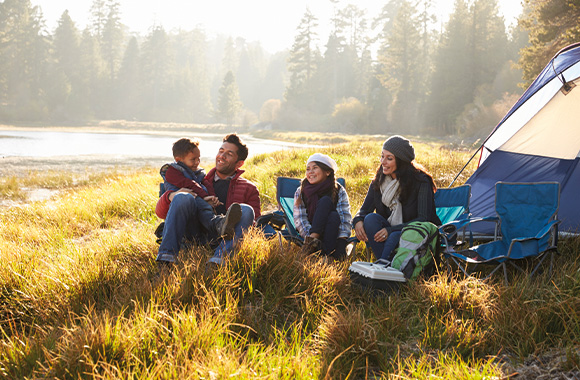 Eco-friendly family holidays: a family on a camping holiday.