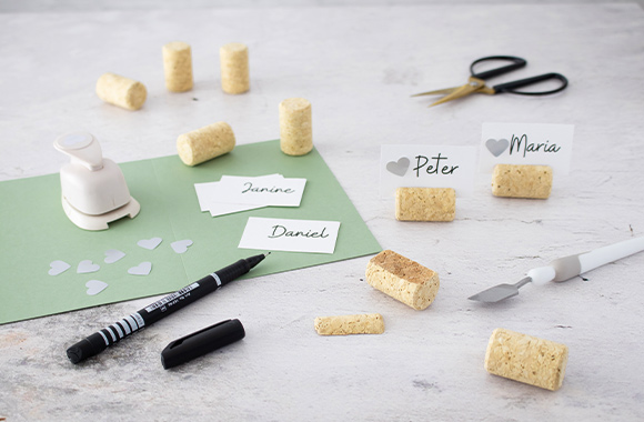 Silver wedding anniversary decorations: craft materials for DIY name cards.