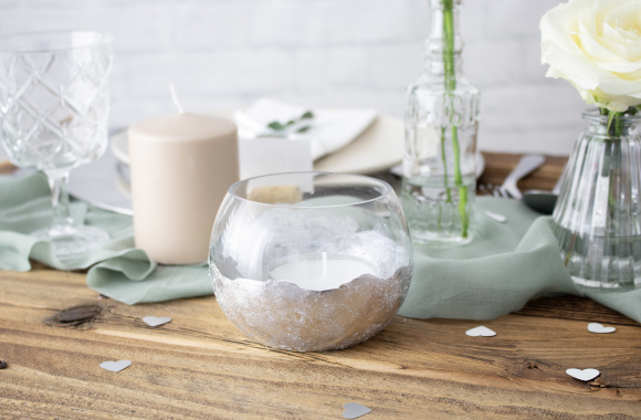 Silver wedding decoration ideas: silver tea light holder on the festive table. Silver wedding decoration ideas: silver tea light holder on the festive table.