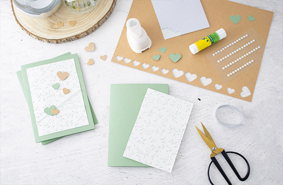 Craft materials for the classic silver wedding invitation.