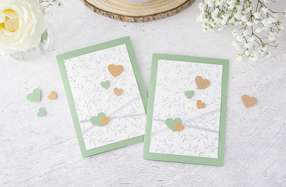 Silver wedding invitation ideas: finished invitation card with hearts.