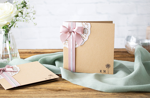 Unique silver wedding invitation card: an invitation with lace decoration. Unique silver wedding invitation card: an invitation with lace decoration.