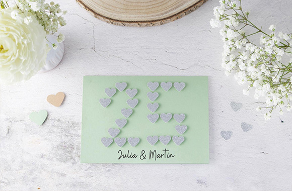 Silver wedding anniversary card: DIY greetings card with a 25 made out of paper hearts. Silver wedding anniversary card: DIY greetings card with a 25 made out of paper hearts.