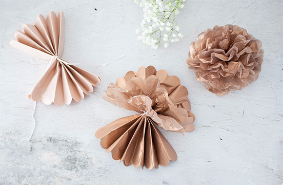 Unique decorations for a handmade silver wedding anniversary gift: paper flowers made from tissue paper. Unique decorations for a handmade silver wedding anniversary gift: paper flowers made from tissue paper.