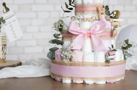 Baby gifts: a brightly decorated nappy cake for a girl.